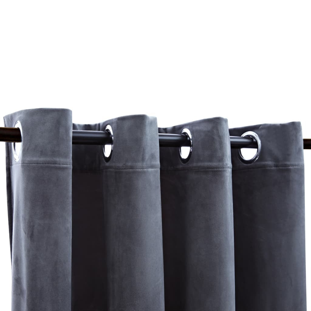 Close-up of anthracite velvet curtain fabric with metal rings showing easy installation system for curtain rod