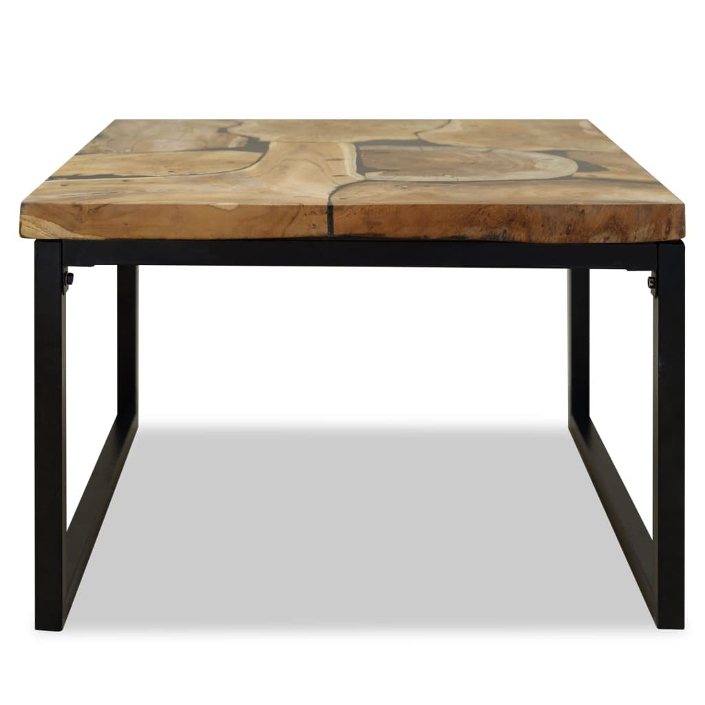 Close-up of teak wood table top showing natural grain and black accents