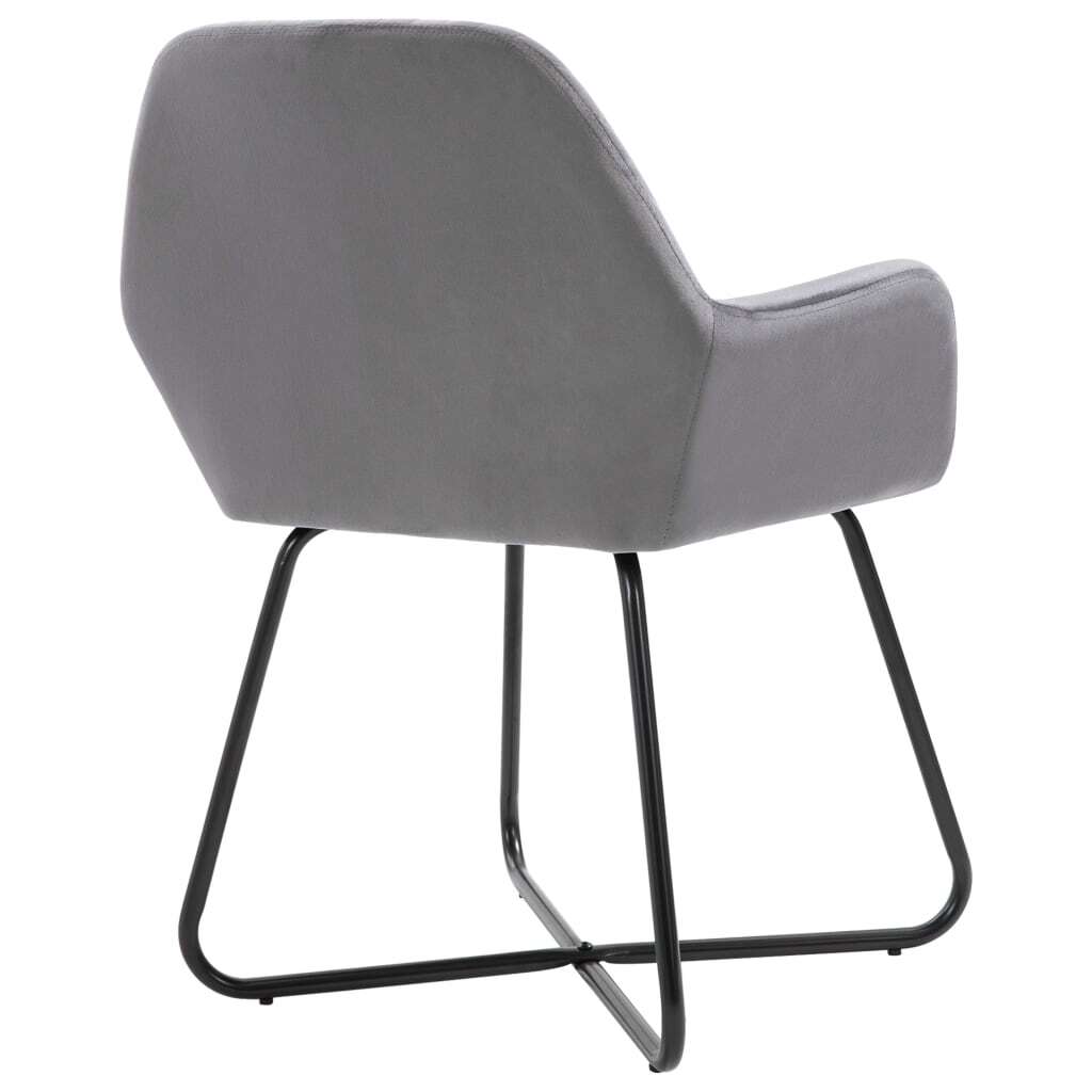 Gray velvet dining chair showing upholstery texture and chair construction