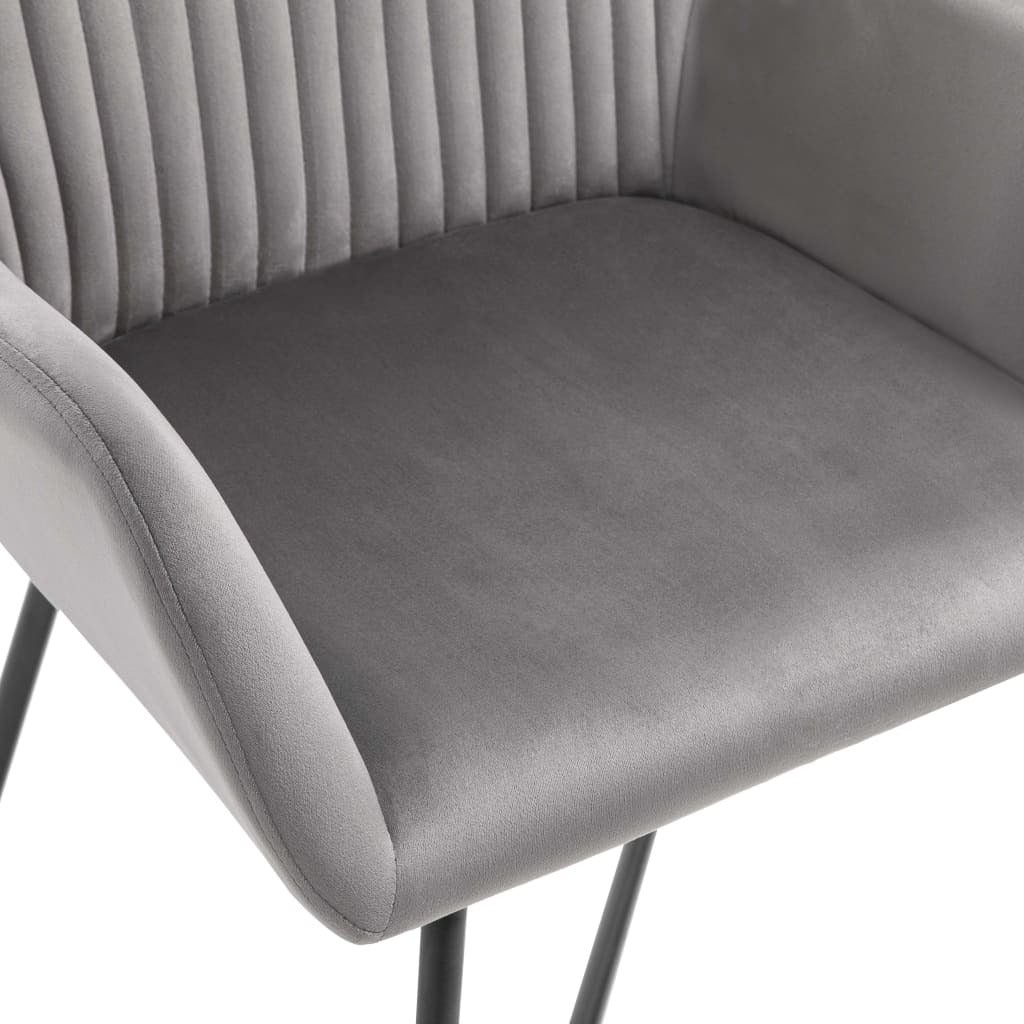 Back view of gray velvet dining chair showing ergonomic backrest design