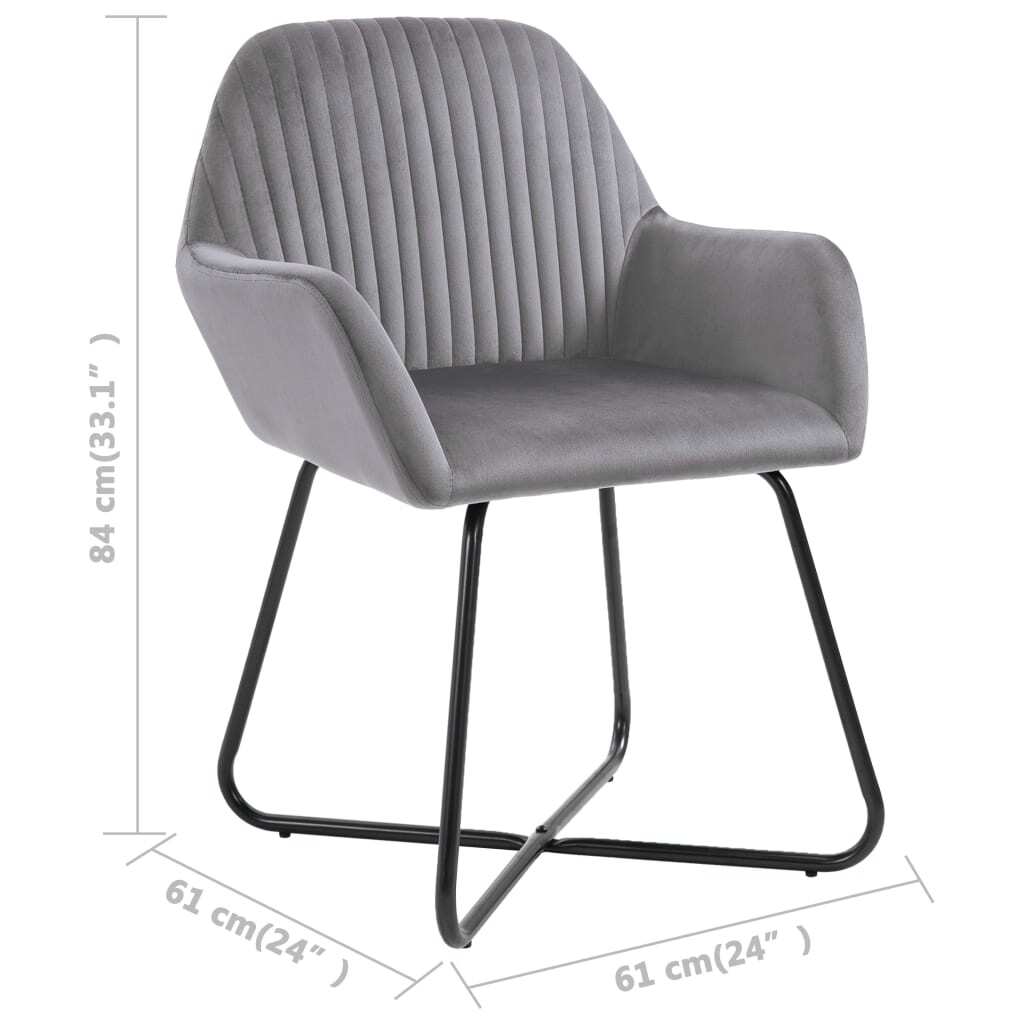Close-up of gray velvet dining chair construction details and metal leg design