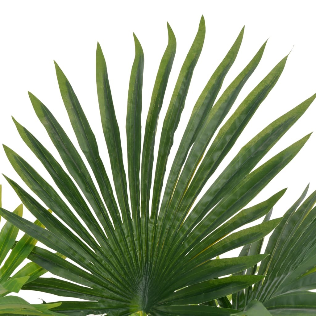 Close-up of lifelike artificial palm plant showing vibrant green fronds and earthy brown pot with wooden base, zero maintenance tropical decorative accent