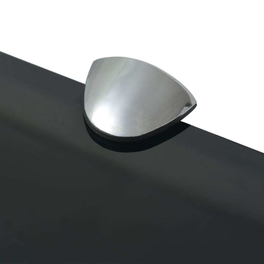 Two black glass shelves arranged on wall creating elegant minimalist display