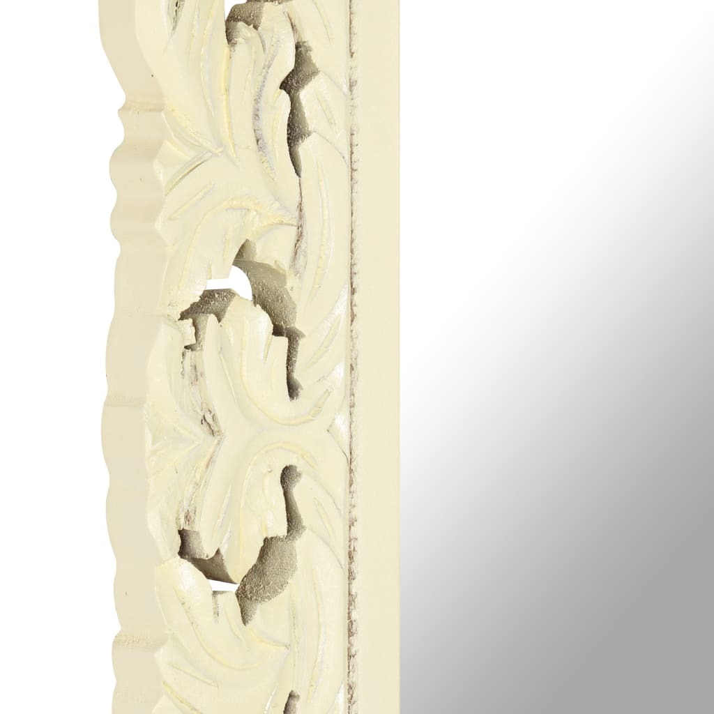 Decorative mirror with intricate carvings on a white background