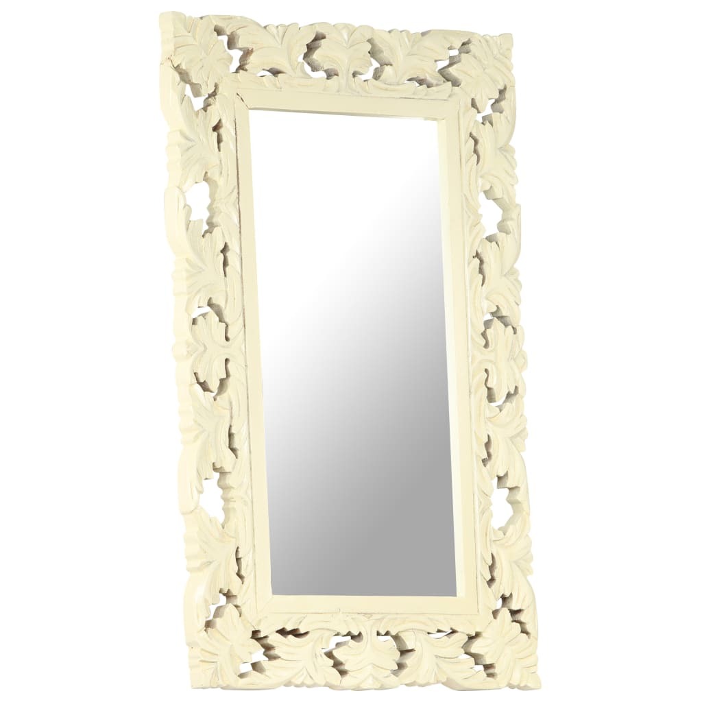 Decorative white mirror with intricate carvings on a white background