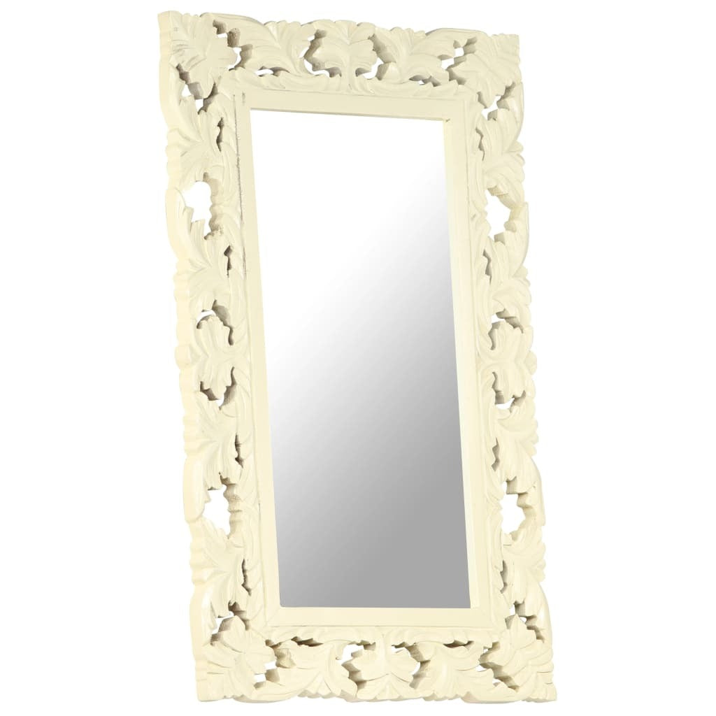 Decorative mirror with intricate carvings on a white background