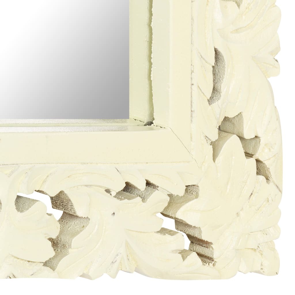 Side angle of solid mango wood mirror showing depth of hand-carved details and white matte finish that reduces glare