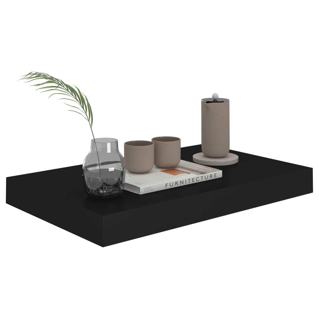 Black floating shelf mounted on wall displaying books and decorative items