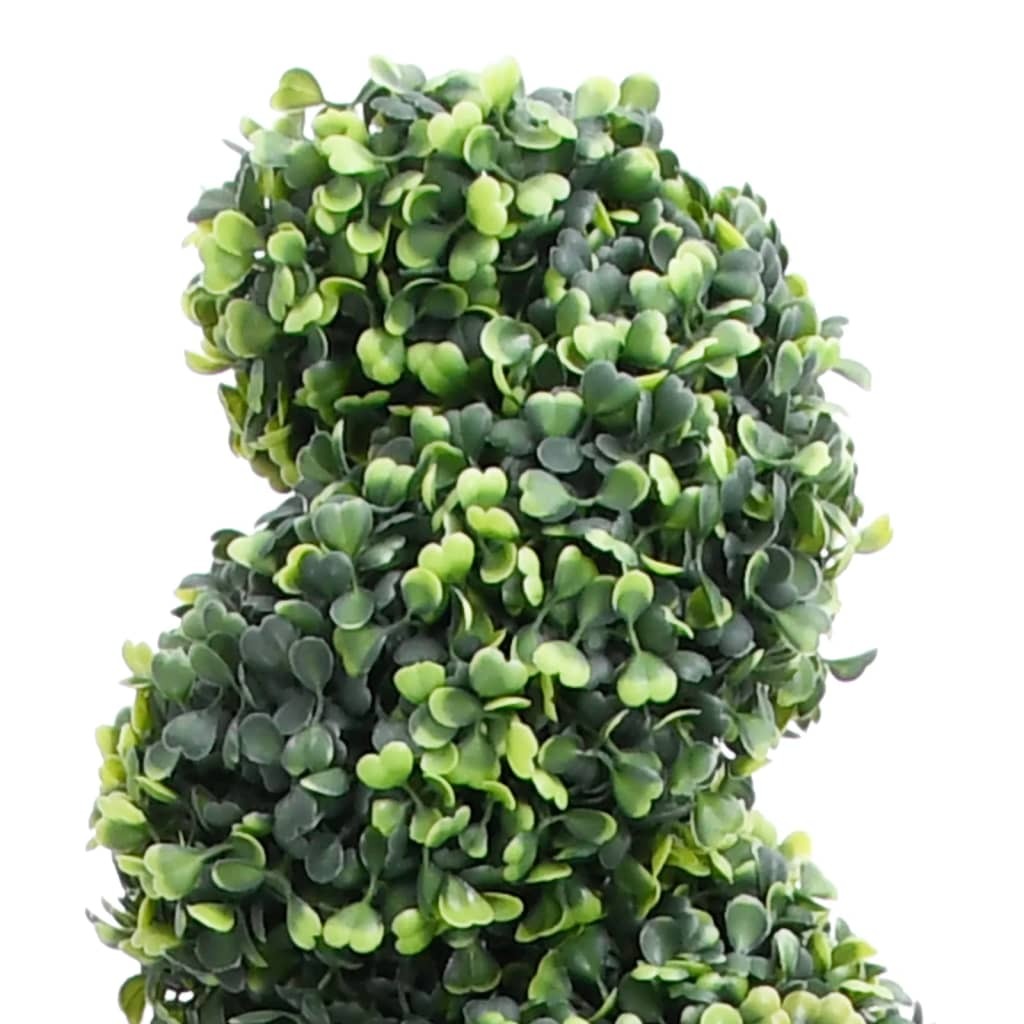 Close-up of realistic artificial boxwood spiral showing dense green foliage and unique twisted architectural design