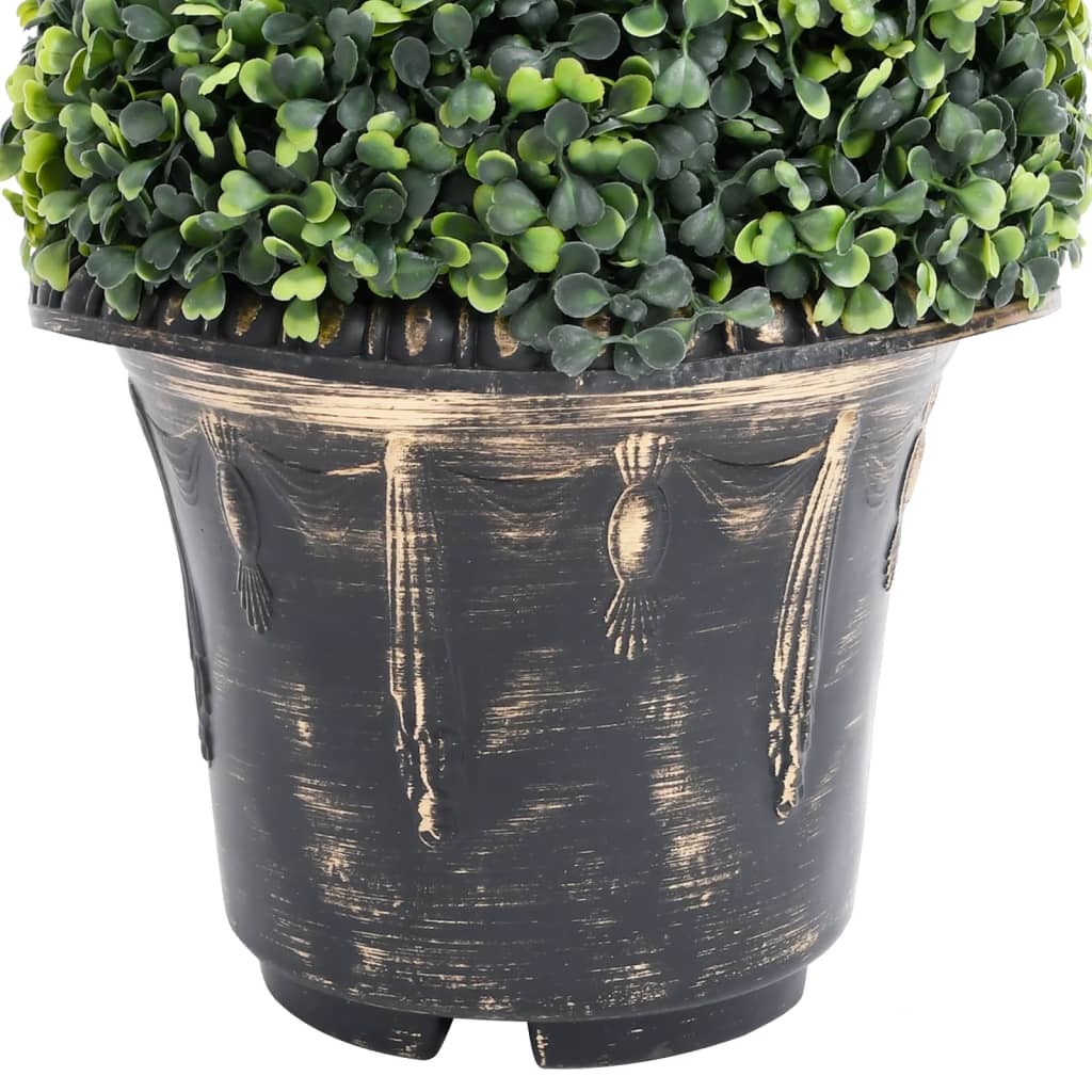 Detail view of artificial spiral boxwood plant showing weather-resistant polyethylene leaves and durable metal construction