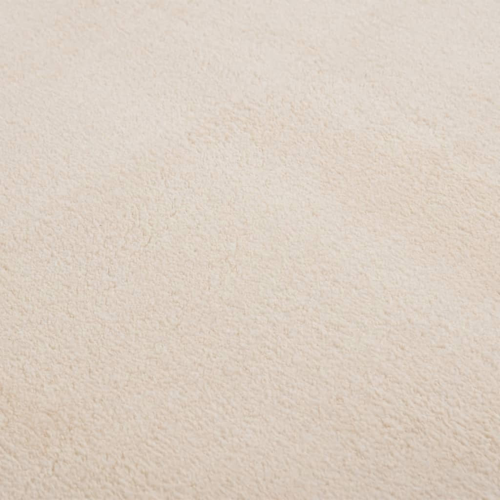 Side view showing 0.7 inch thickness and plush texture of beige rug