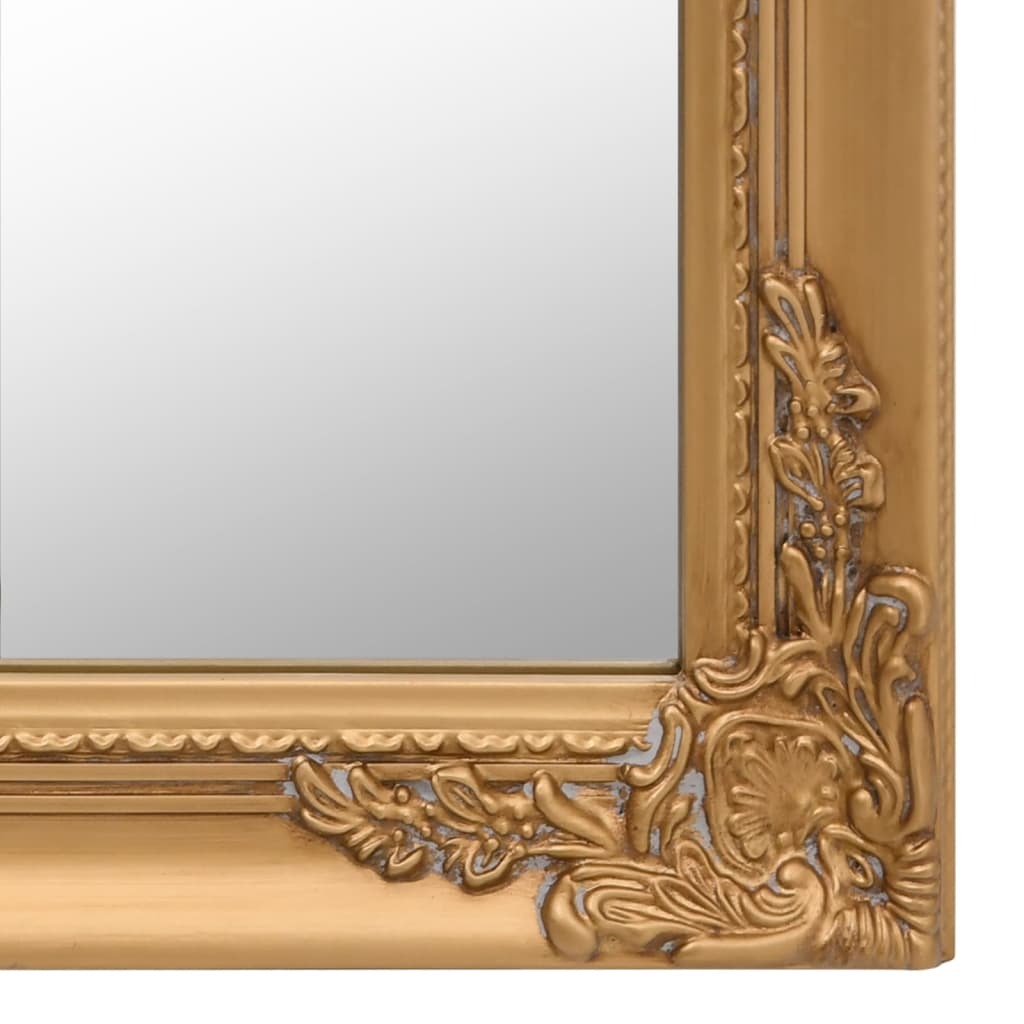 Ornate gold standing mirror in room setting showing how it enhances bedroom or dressing room decor