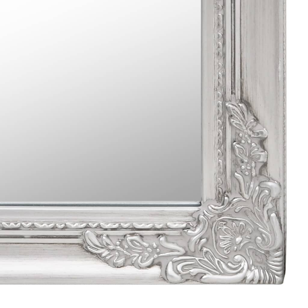 Three-quarter view of freestanding floor mirror emphasizing full-length design and stable base with intricate baroque detailing