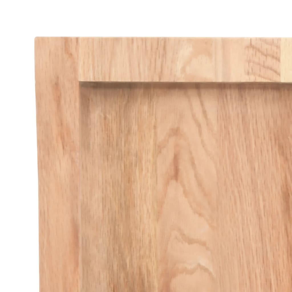 Oak floating shelf styled with plants and photo frames in contemporary setting