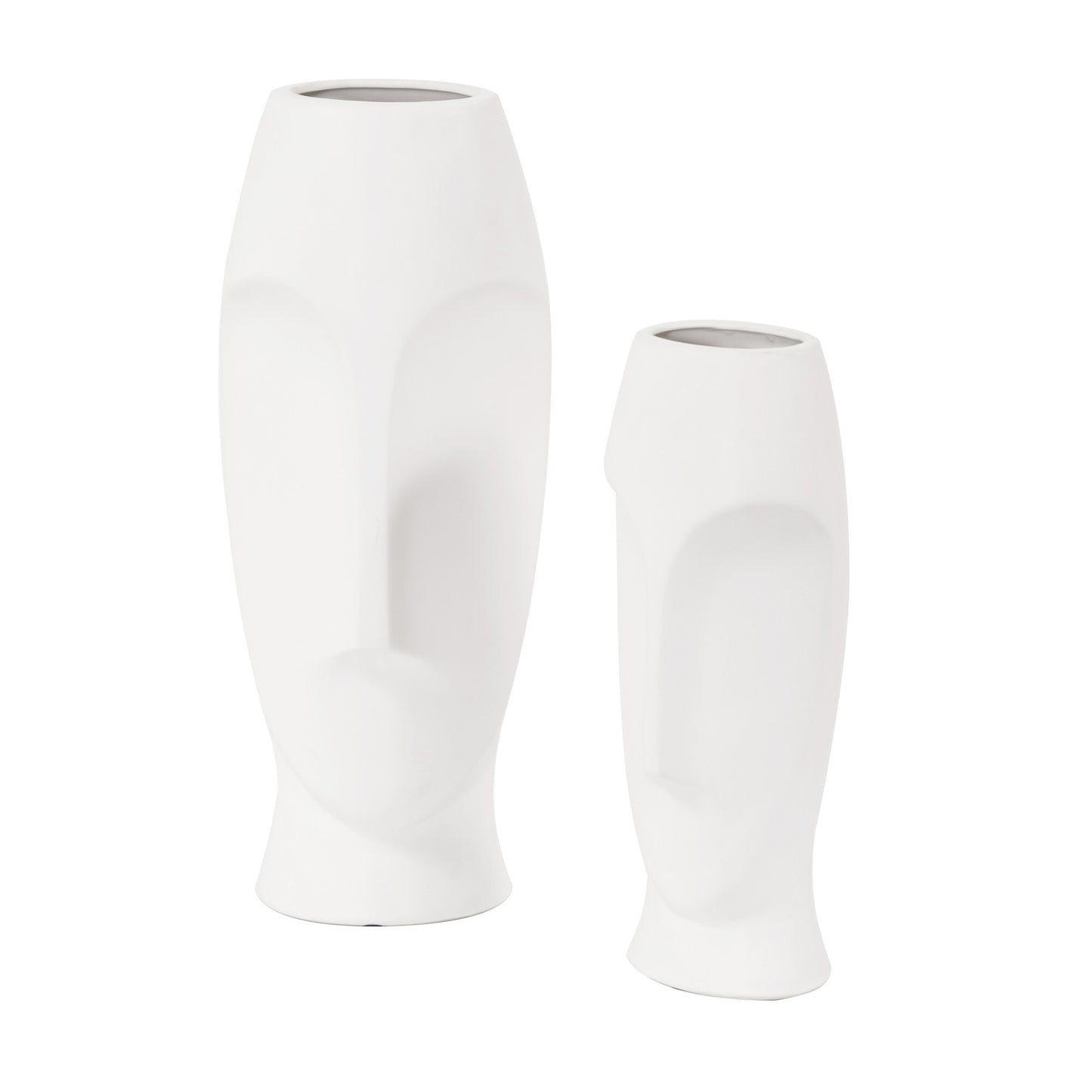 Close-up of abstract face design on white ceramic vase with contemporary artistic flair