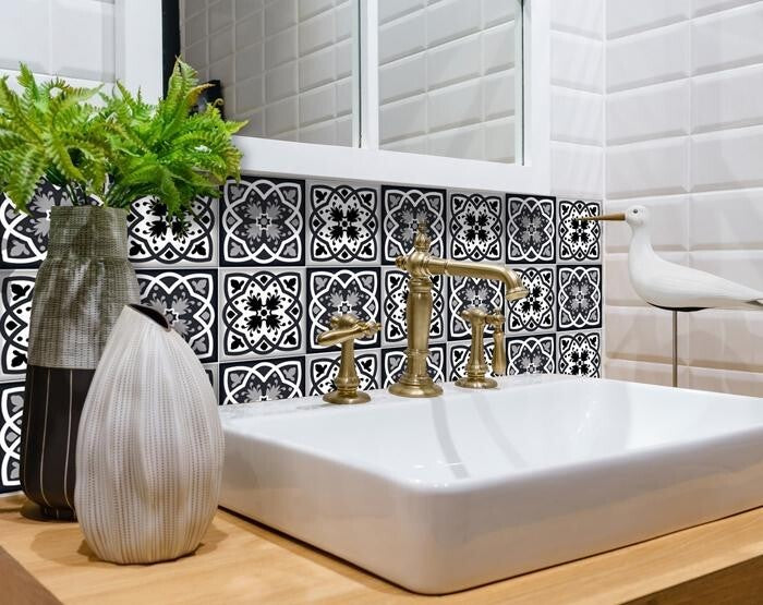 Kitchen wall decorated with black white gray 6x6 removable tiles creating sophisticated modern design
