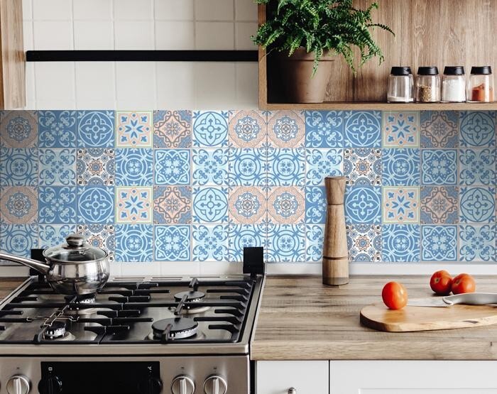 Bathroom wall featuring ocean blue mosaic peel and stick tiles as decorative accent