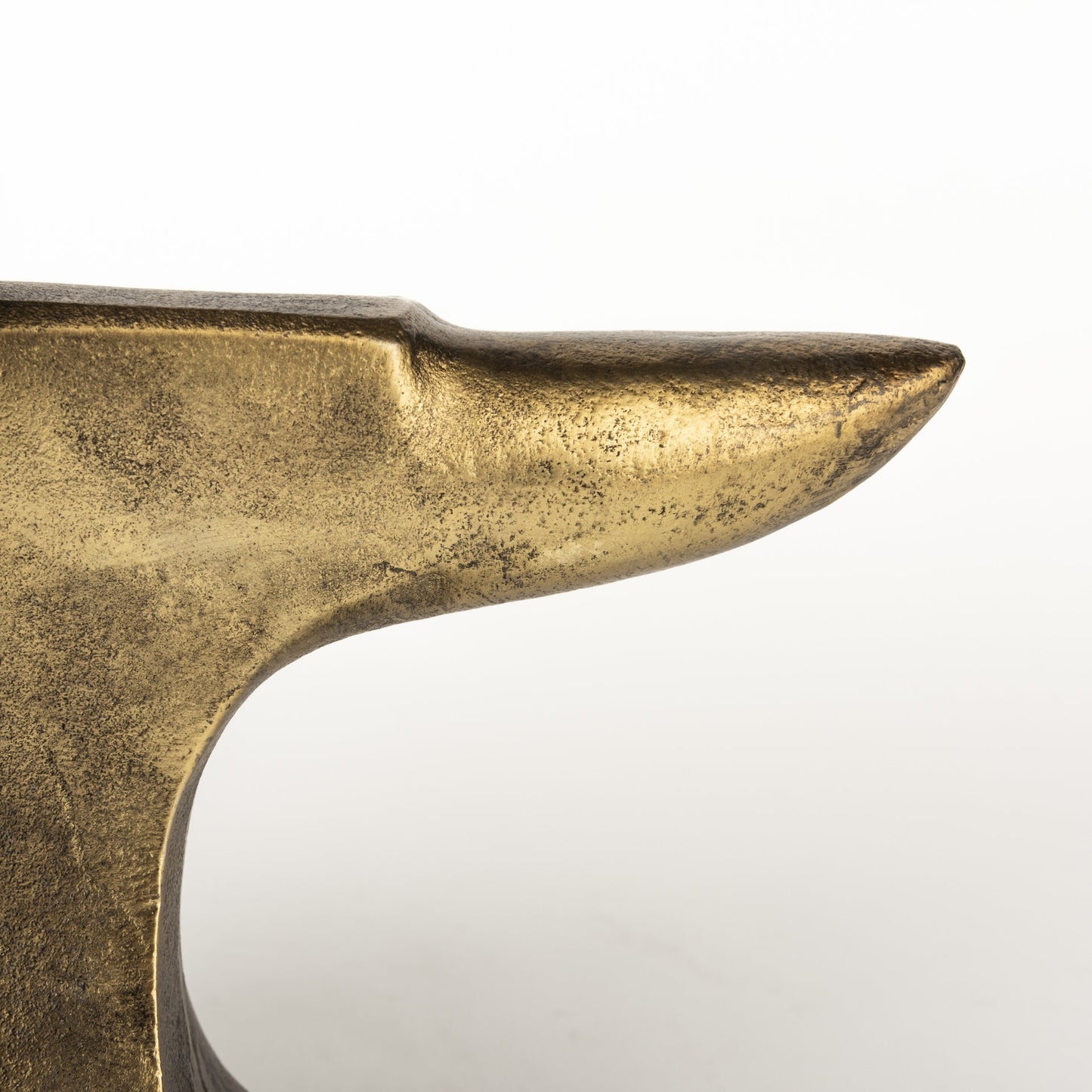 Pair of distressed gold anvil bookends displaying substantial weight and non-slip design for stable book storage