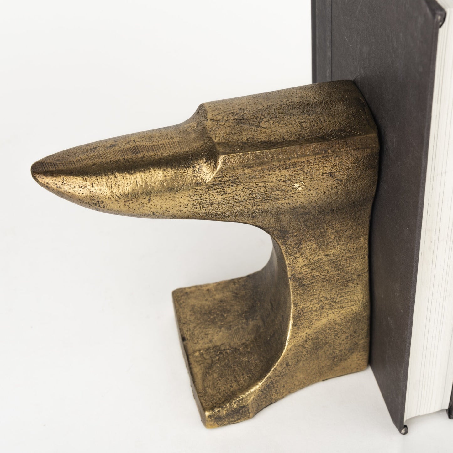 Full view of brushed gold anvil bookends with industrial design, perfect decorative accent for office library or home study