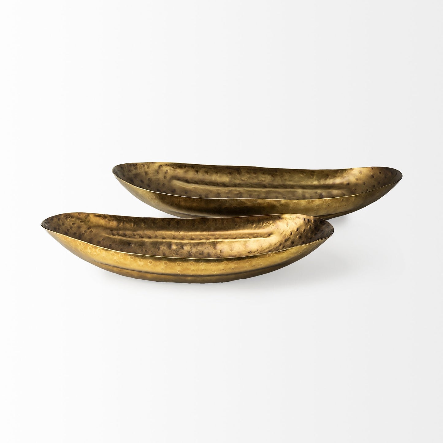 Close-up of hand-hammered texture on rustic bronze gold metal bowl with artisan craftsmanship