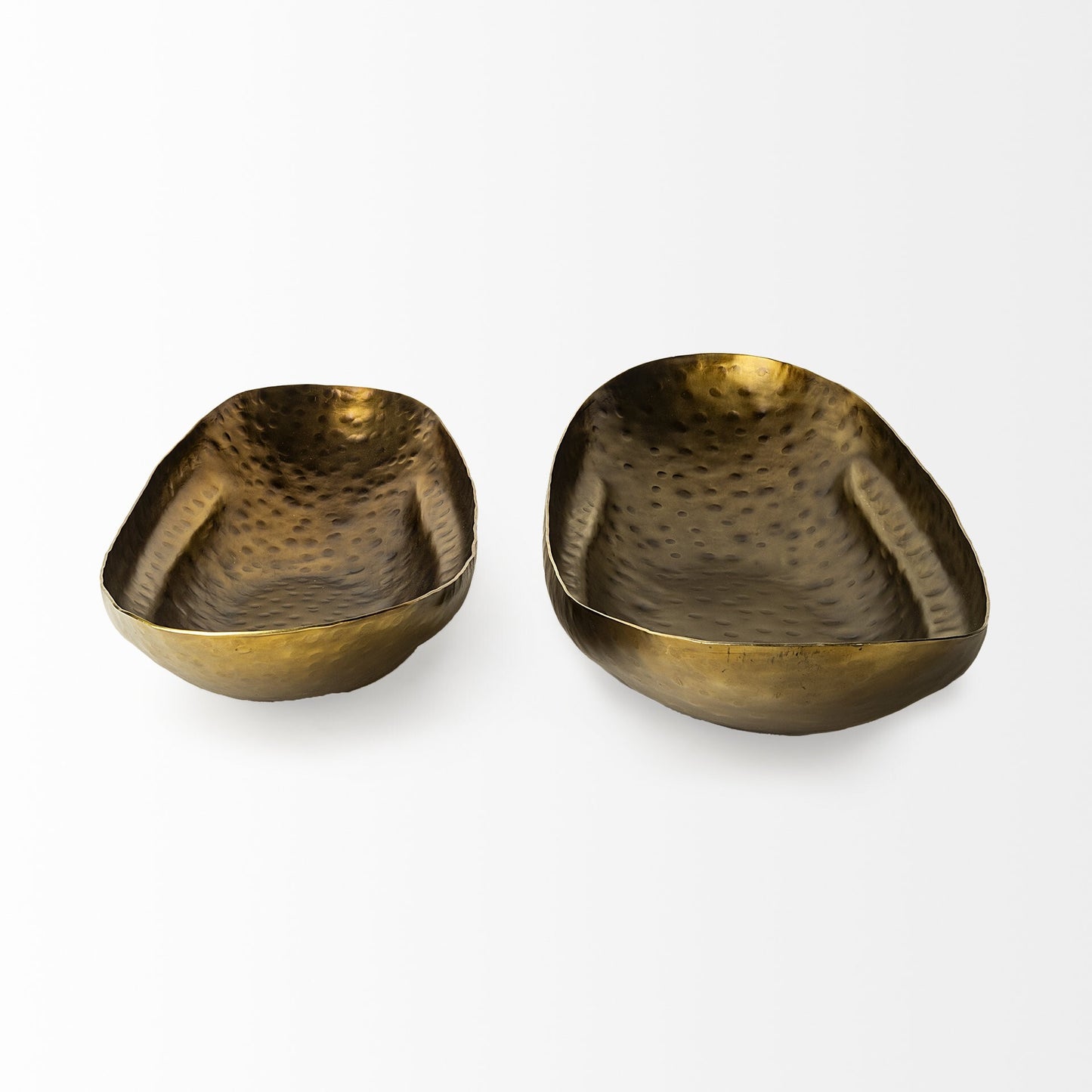 Top view of boat shaped decorative bowls showing elongated silhouette and hammered metal detail
