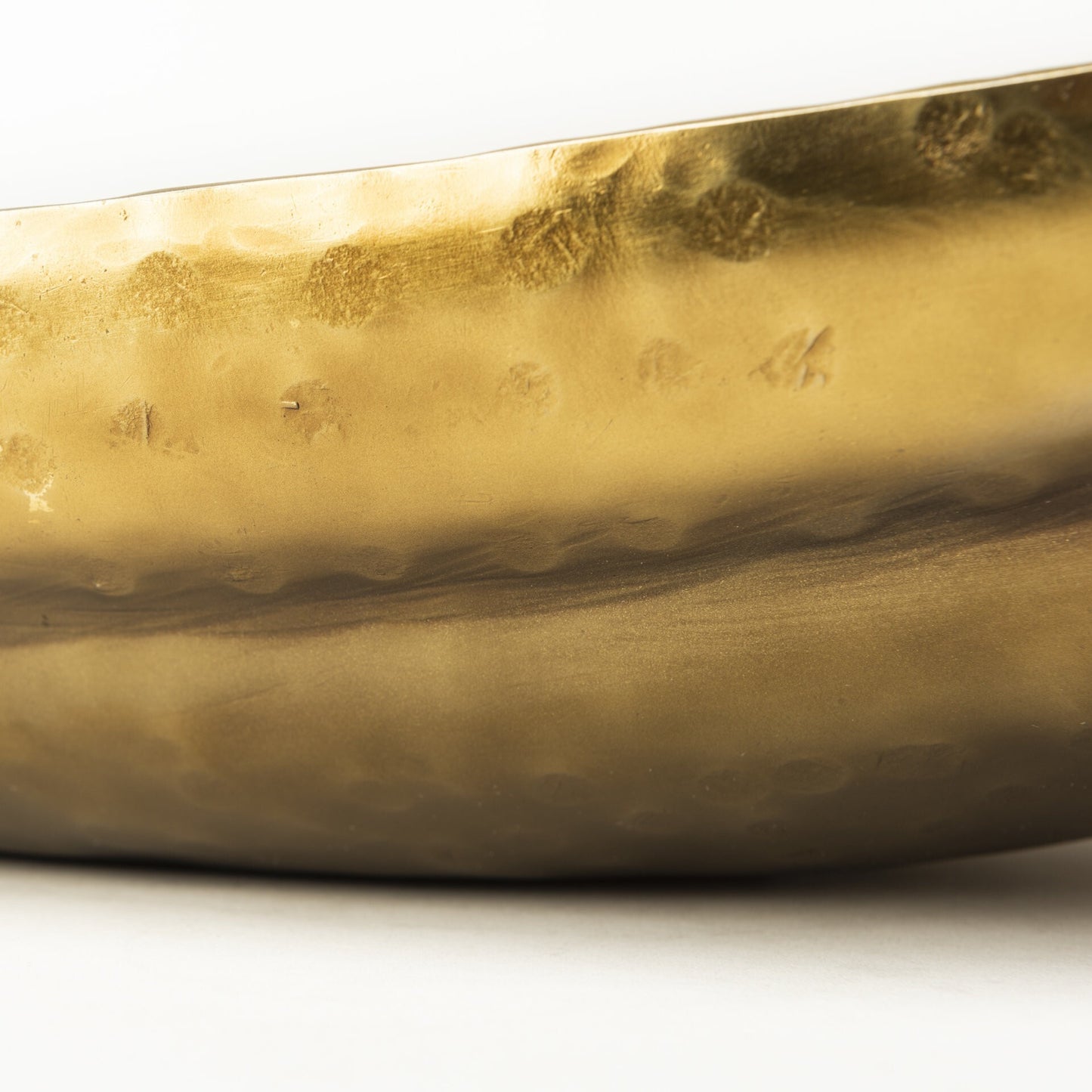 Large boat shaped decorative bowls in distressed gold finish ideal for rustic modern interiors