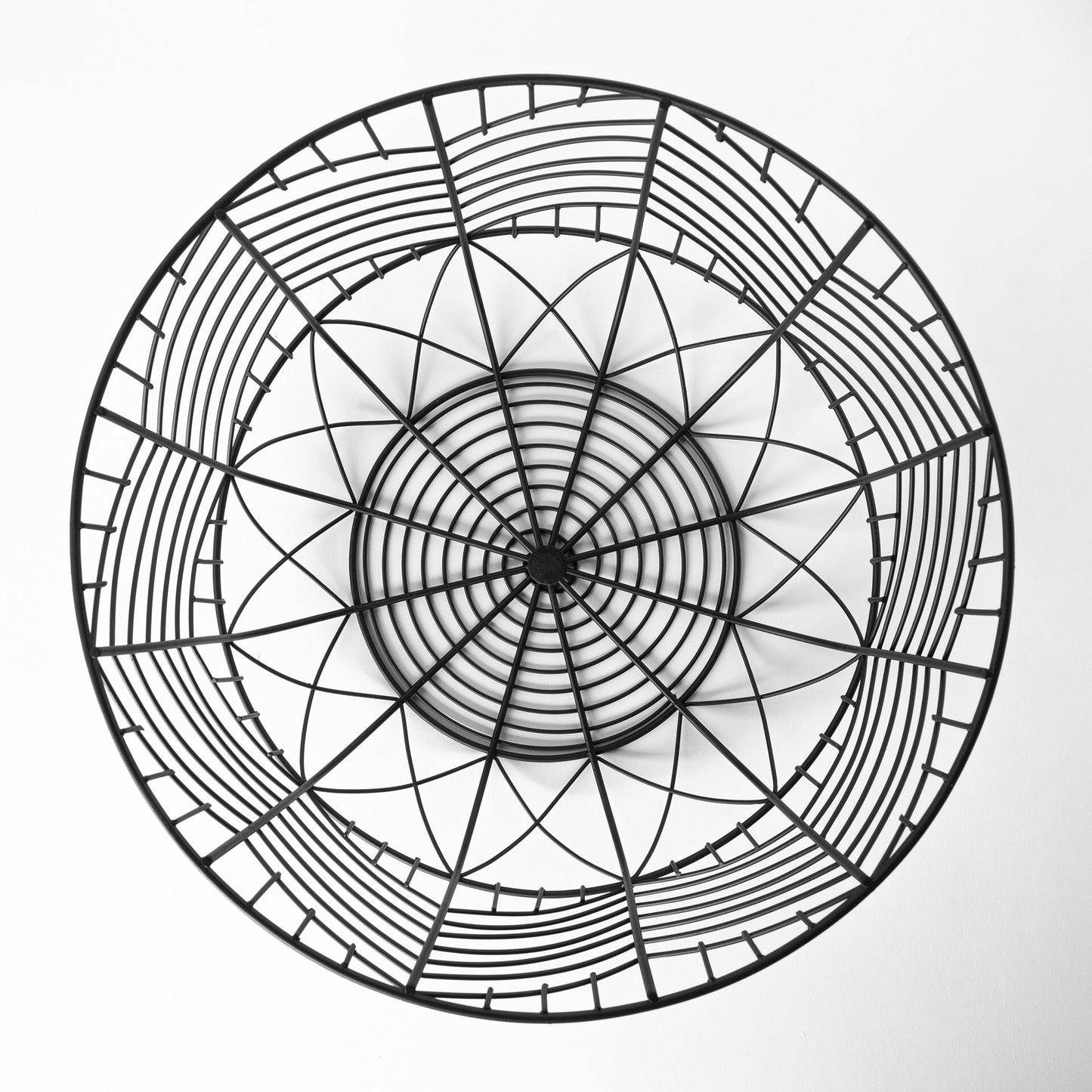 Black wire bowls geometric chevron detail shot highlighting trendy pattern and metal craftsmanship