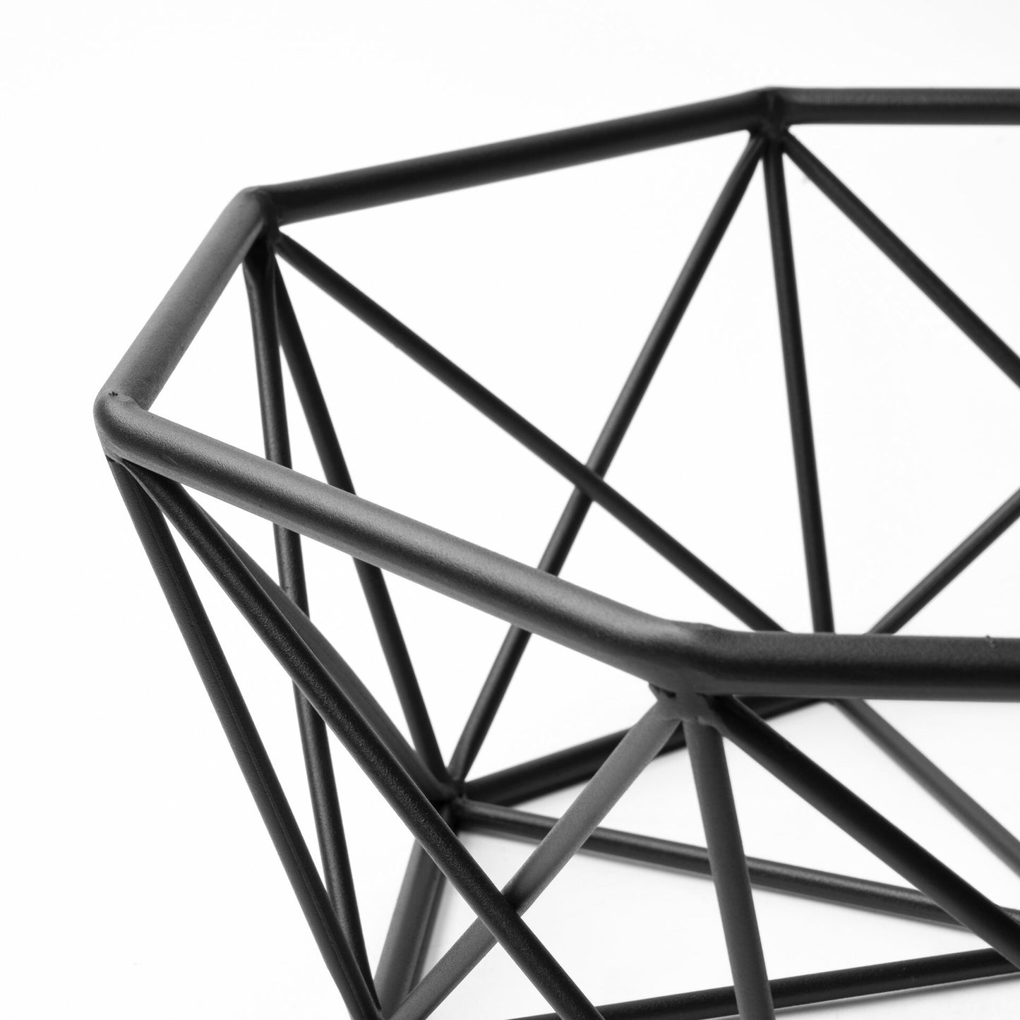 Modern industrial black metal bowl with architectural geometric pattern, versatile table accent