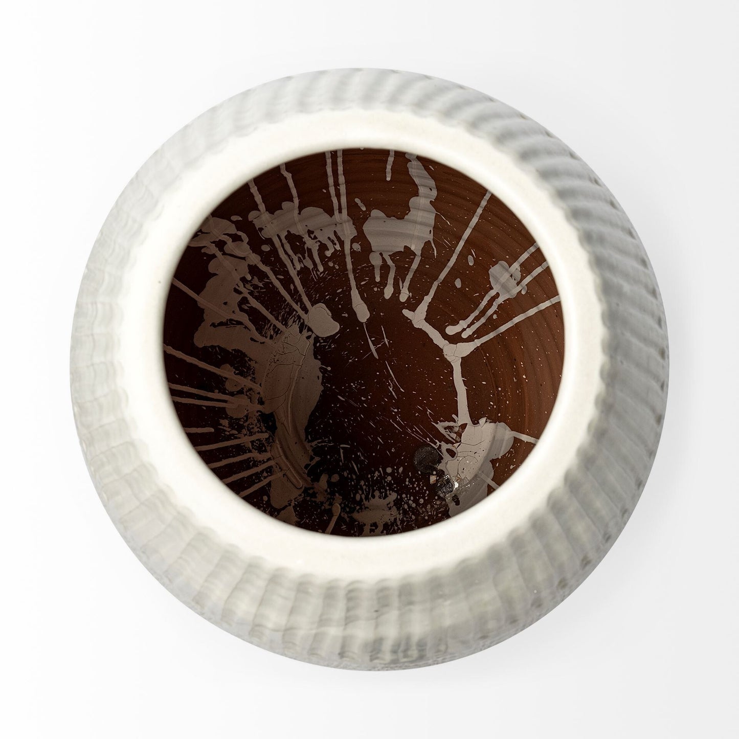 Round decorative object with brown abstract design on a white background