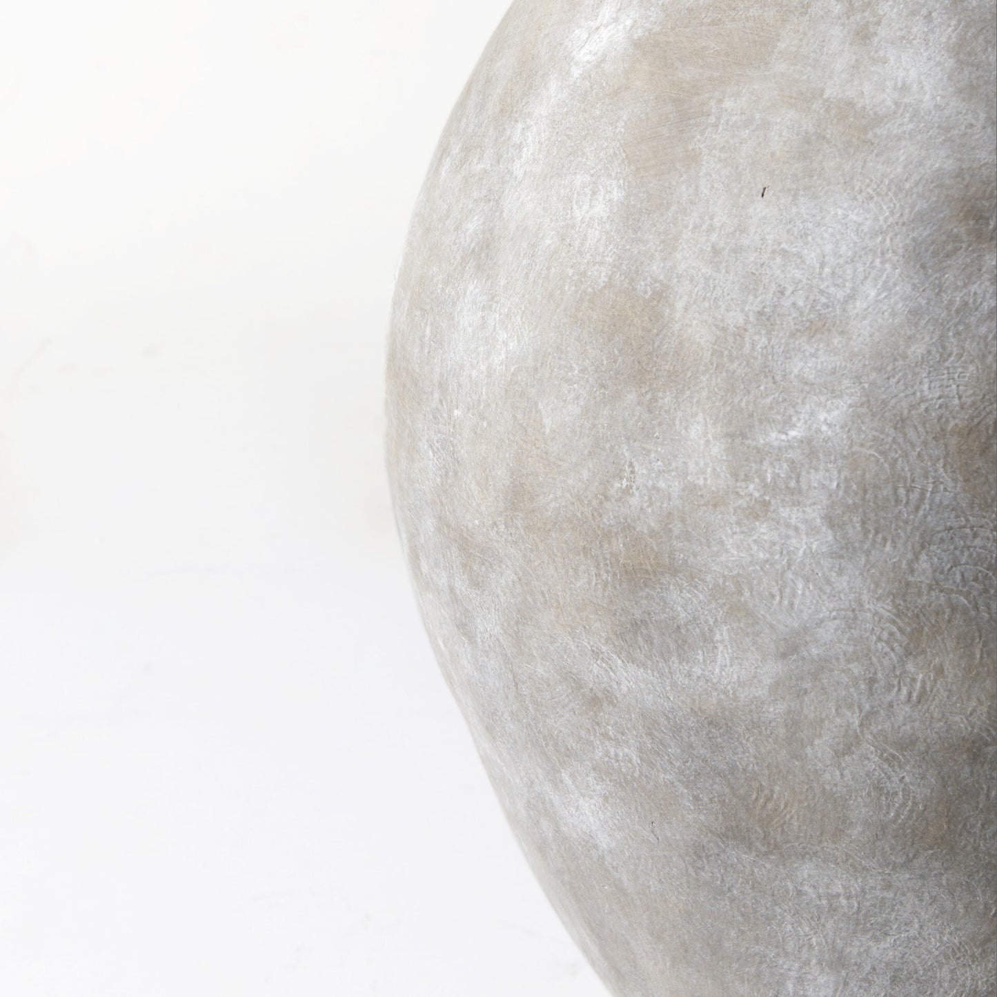 Natural wash ceramic Kyros vase on display, dramatic statement piece for modern interiors