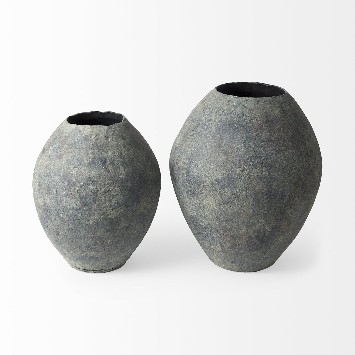 Close-up of distressed textured finish on earthy gray ceramic vase with unique character