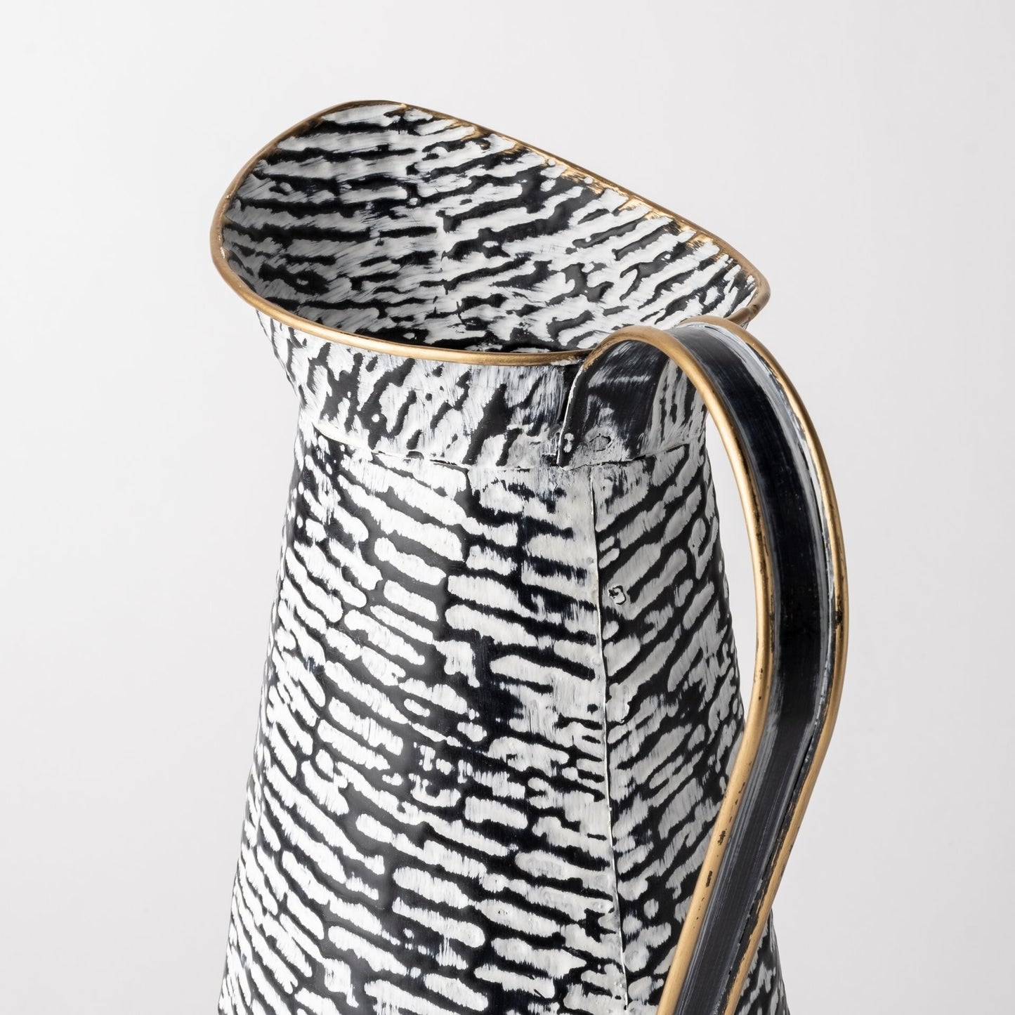 Metal cylinder jug vase displaying modern abstract design and luxurious gold lacquer accents