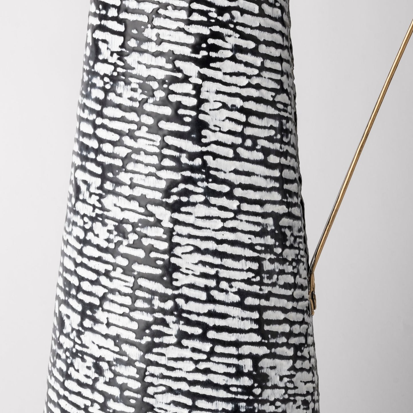 Modern metal vase with textured black white finish and gold trim, statement piece for living room or dining room