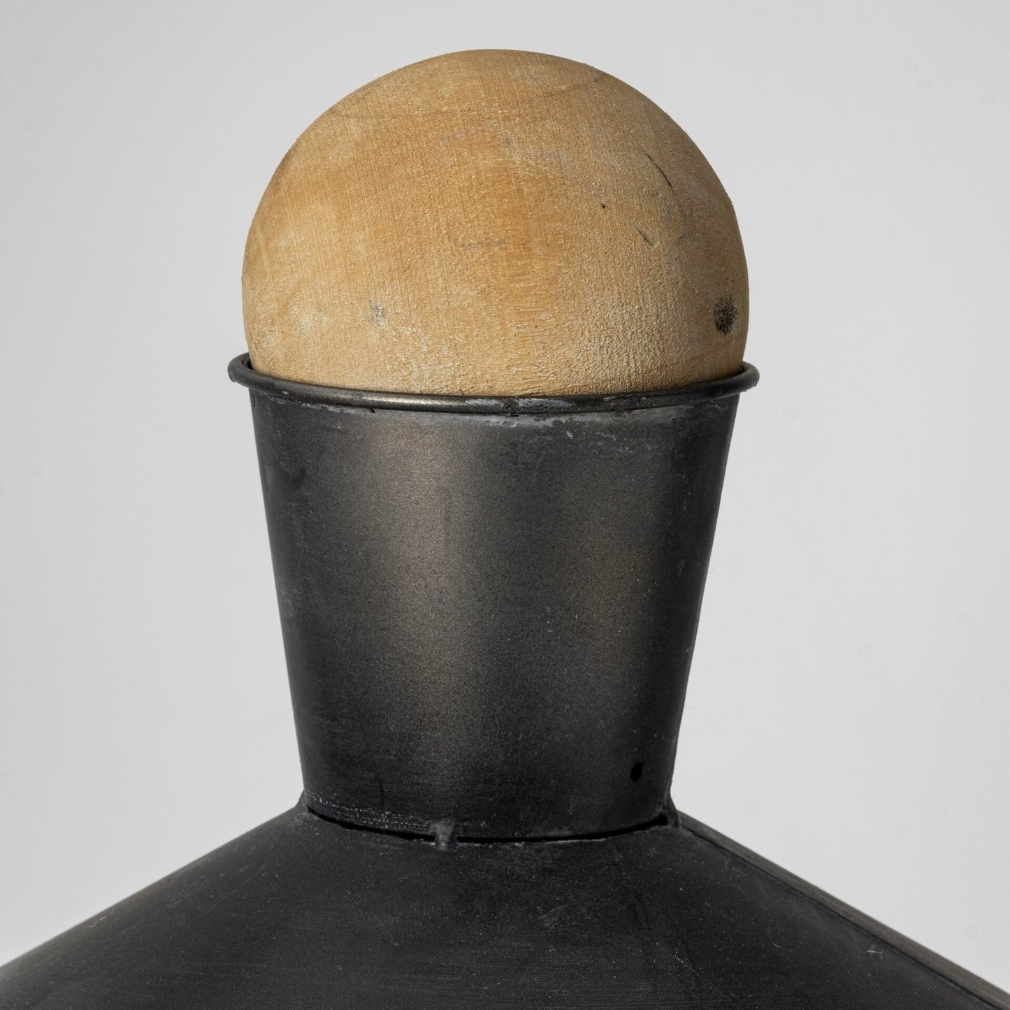 Top view of metal urn showing round solid wood ball stopper detail