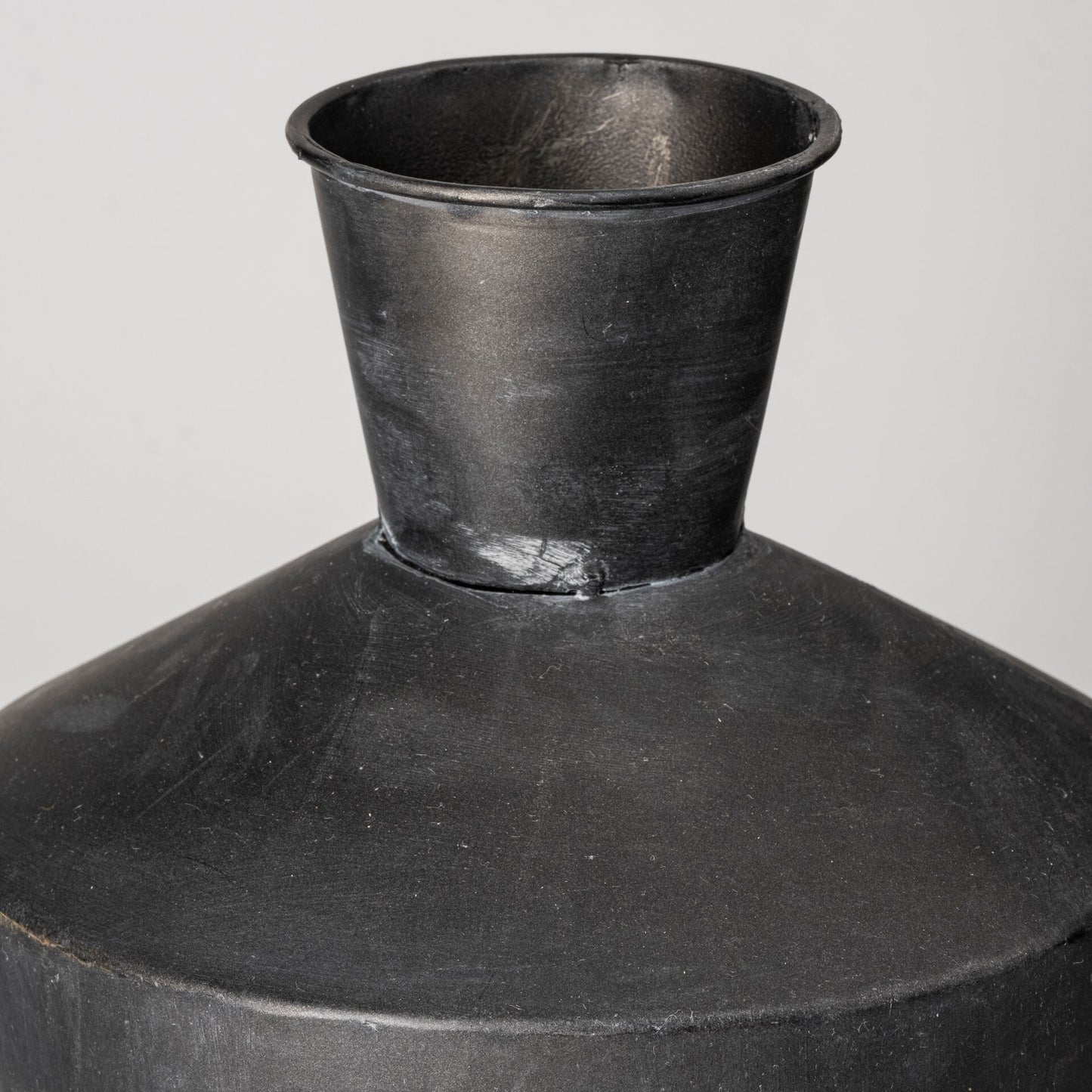 Pair of black metal decorative urns with wood stoppers perfect for modern industrial decor