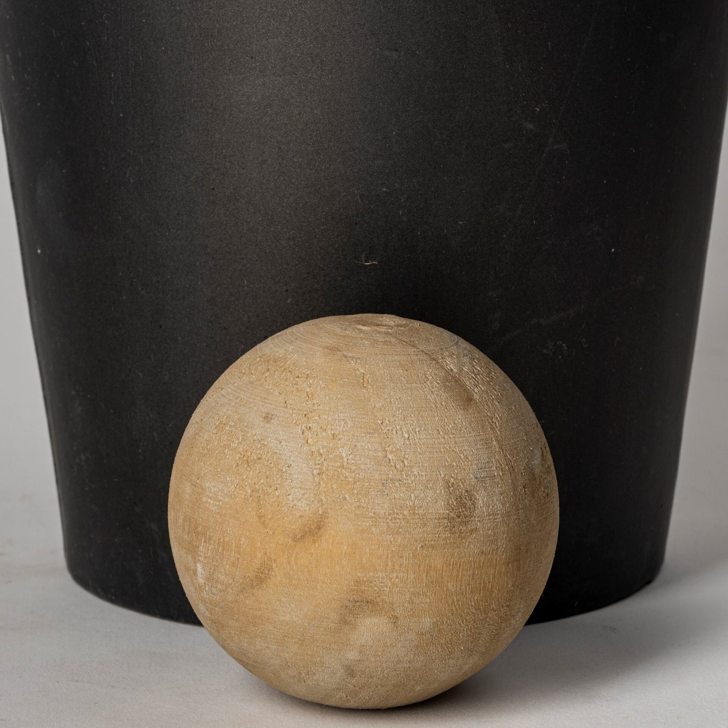 Contemporary metal cylindrical urns in two sizes with distressed finish for versatile styling