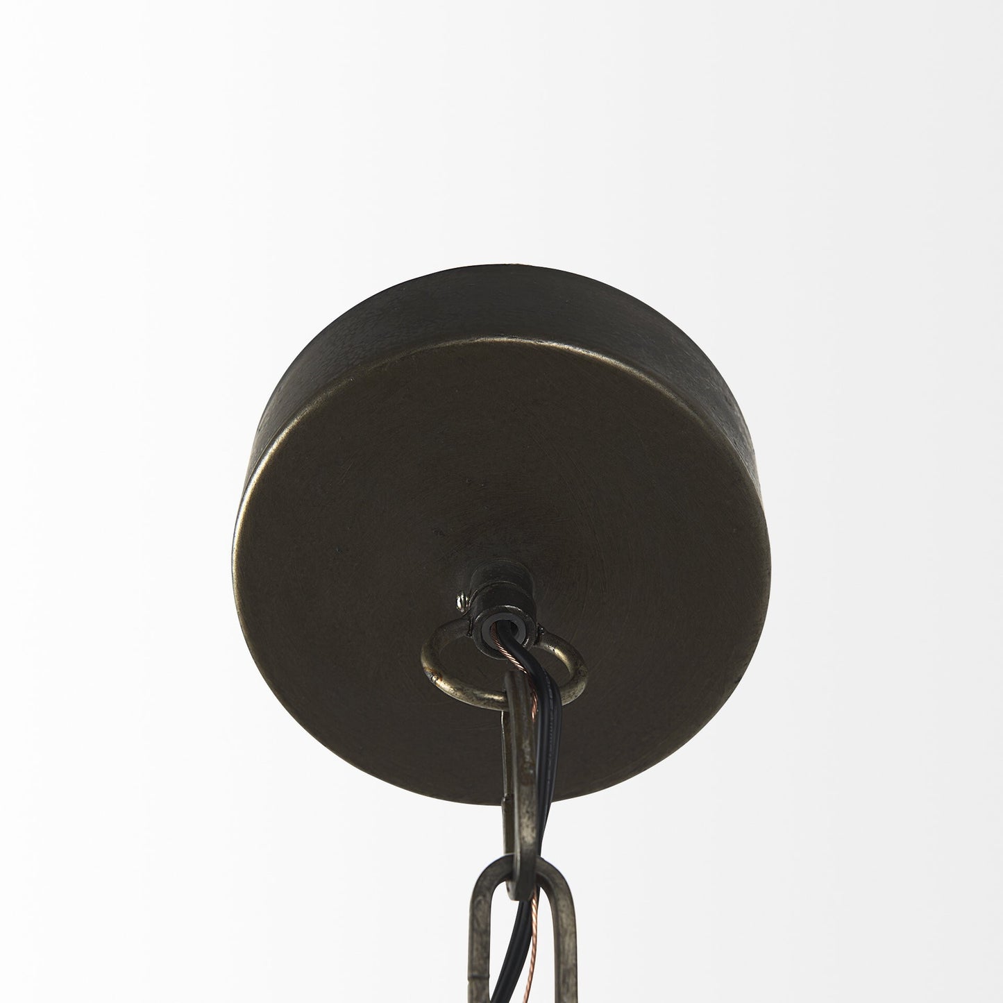 Close-up of industrial pendant lamp showing metal cage construction details