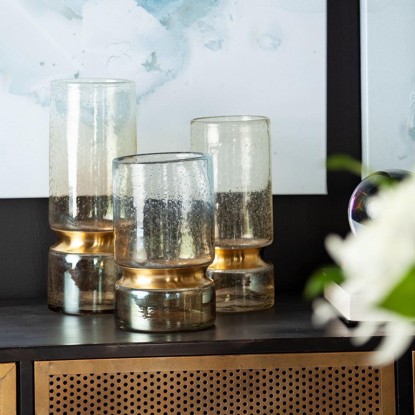 Sophisticated gray glass vase with indented gold metal detail for contemporary home decor