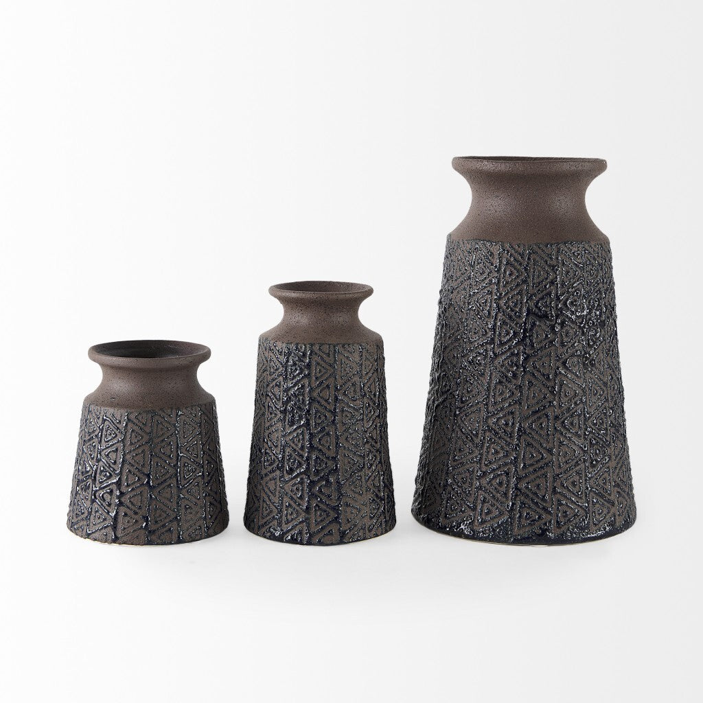 Brown tribal vase close-up displaying embossed texture and geometric pattern detail for boho decor