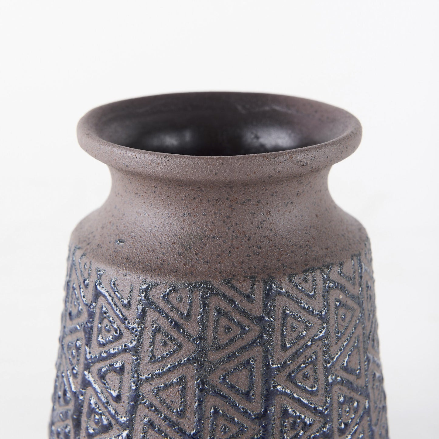 Geometric tribal vase side view displaying speckled brown finish and black embossed pattern
