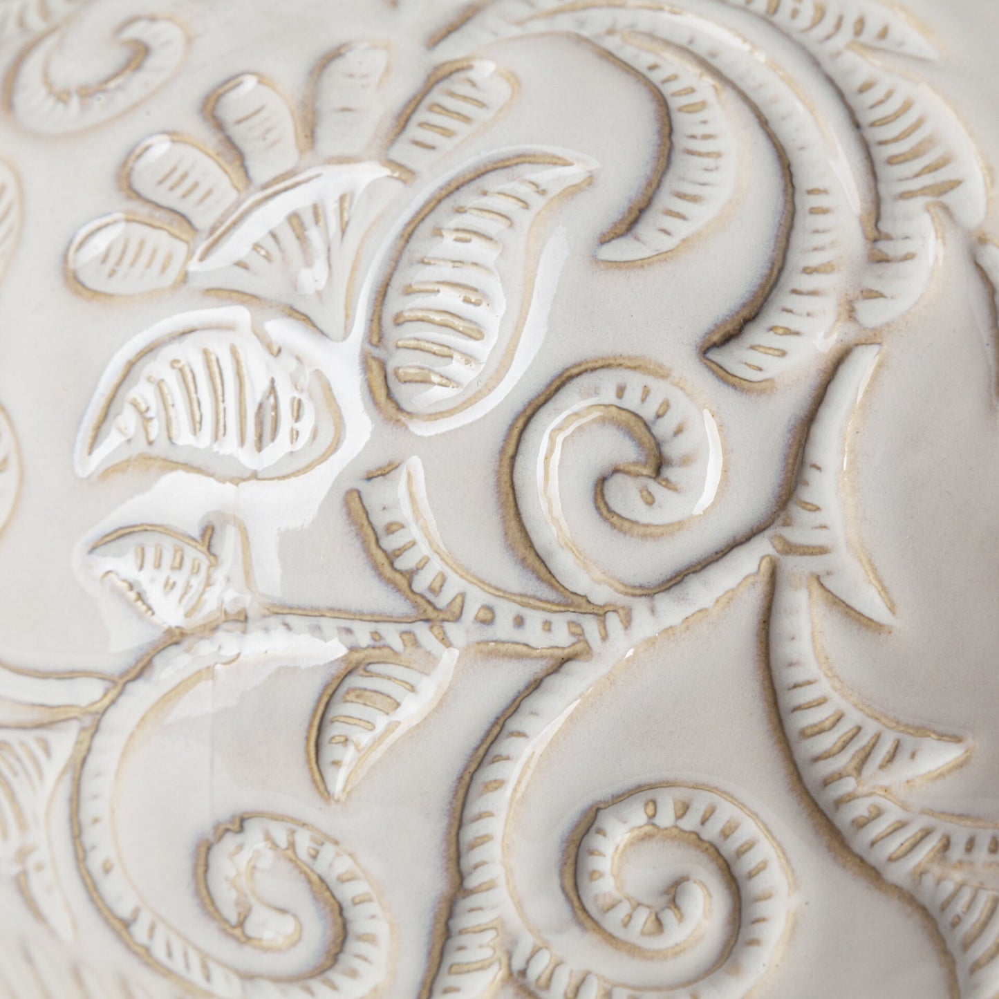 White ceramic carved vase on display, timeless accent for desks and small tables