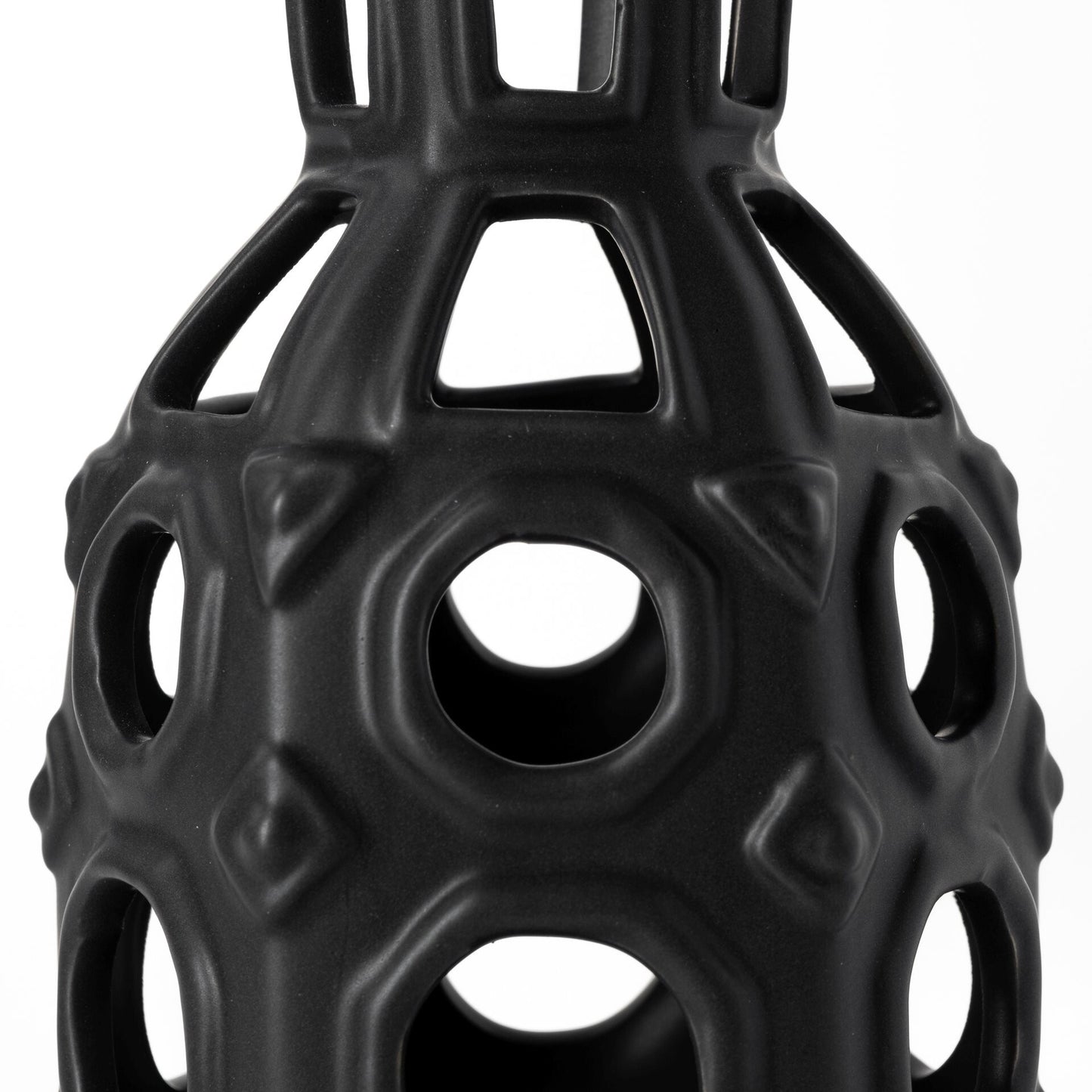 Contemporary black pierced pattern vase with unique circular cutouts for modern home decor