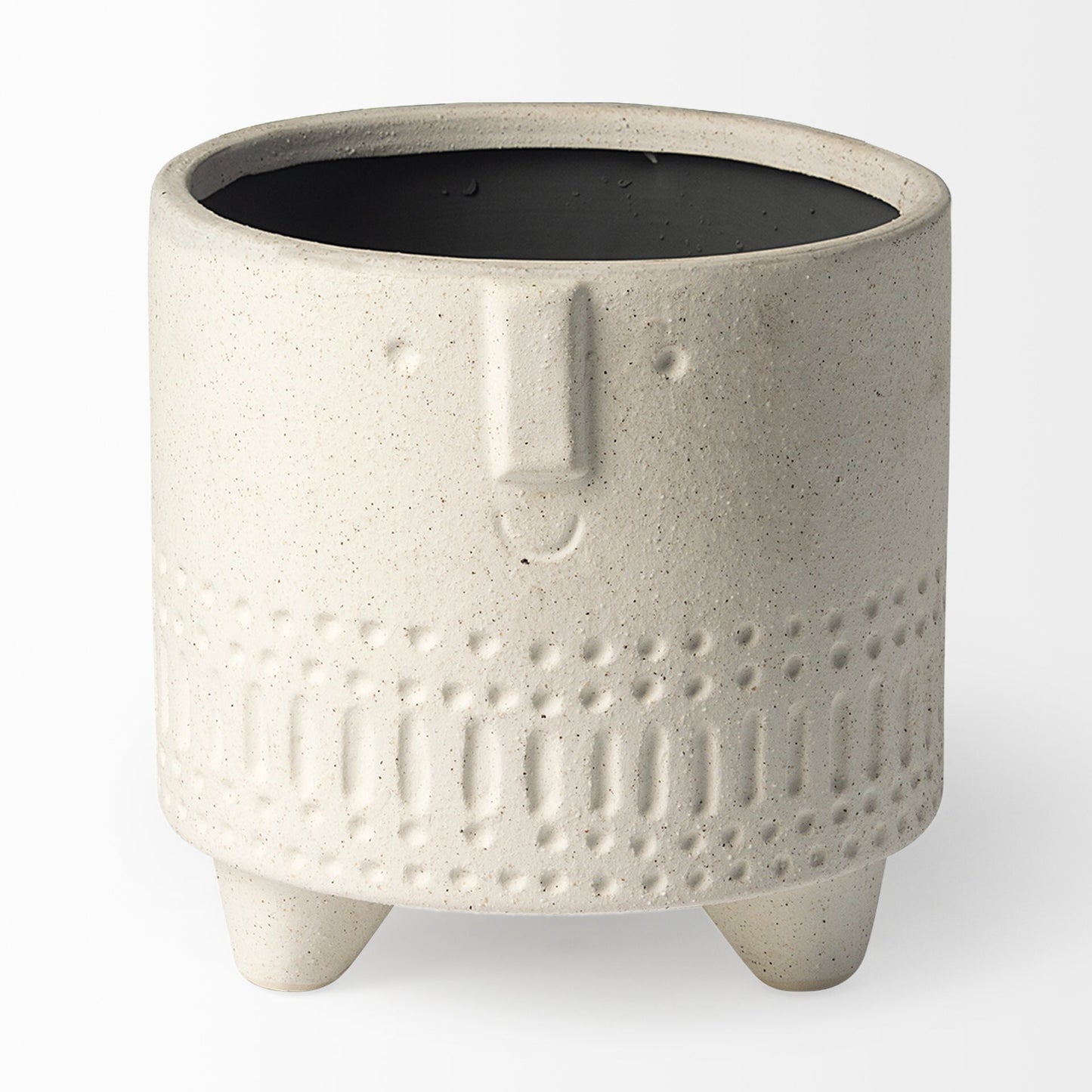 Side view of bohemian vase with four stubby legs and tribal carved patterns, unique ceramic planter for eclectic interiors