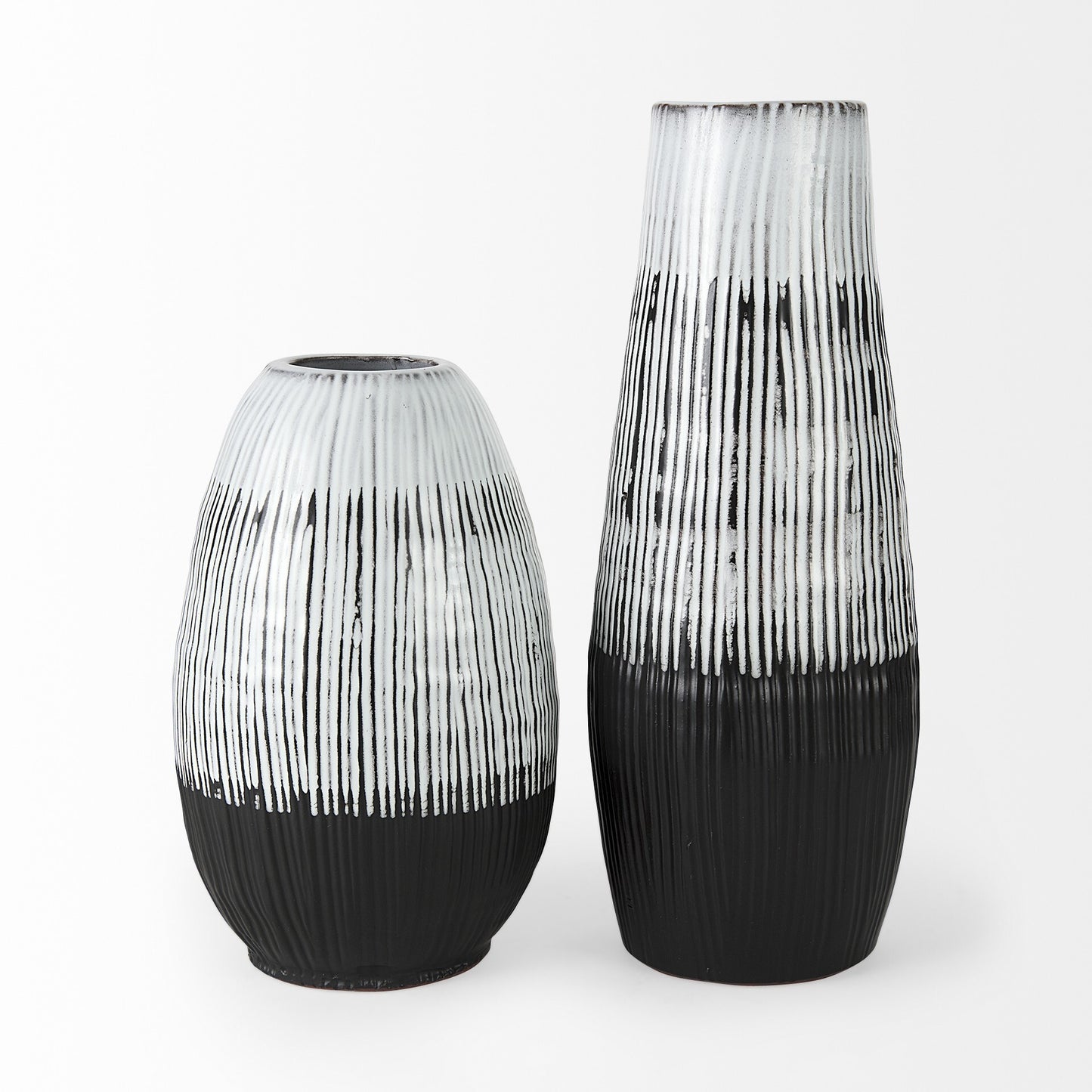 Contemporary ceramic vase close-up displaying textured white striped pattern with black edge details