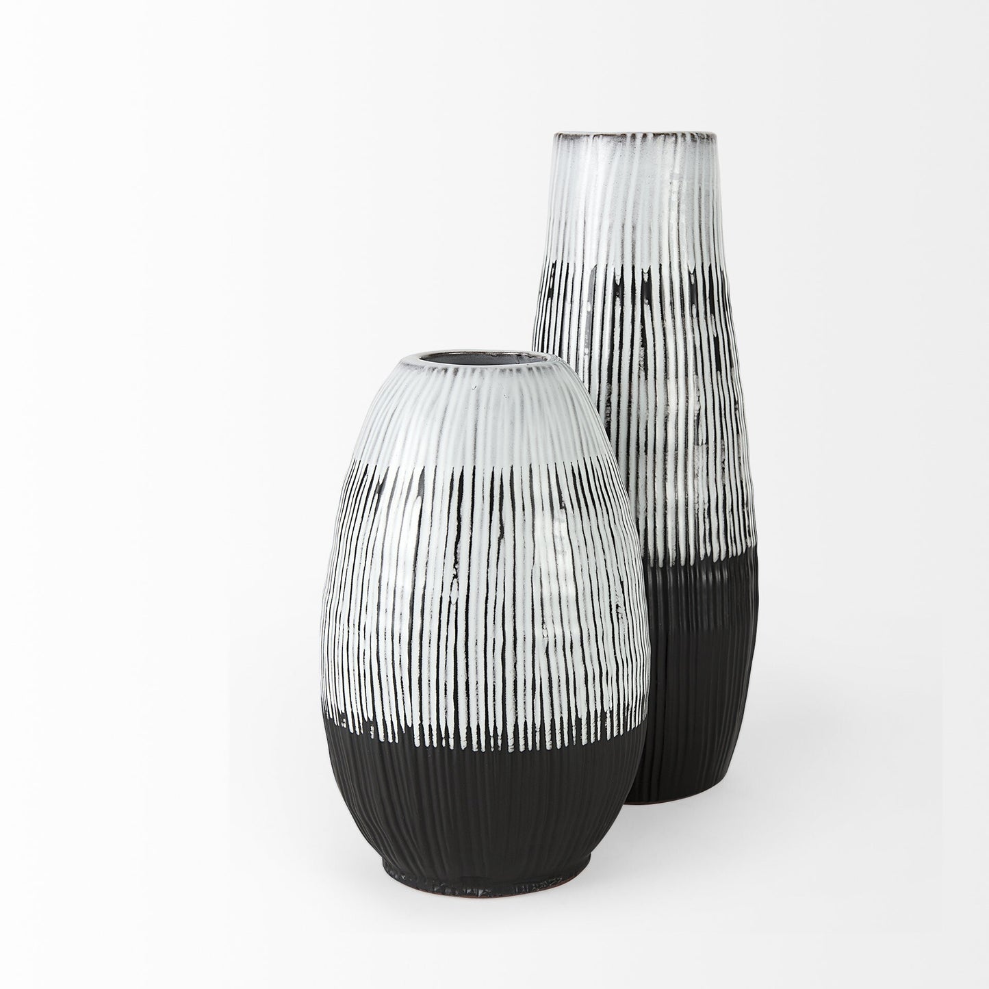 13 inch pod shaped vase showing black glazed base transitioning to white striped top section