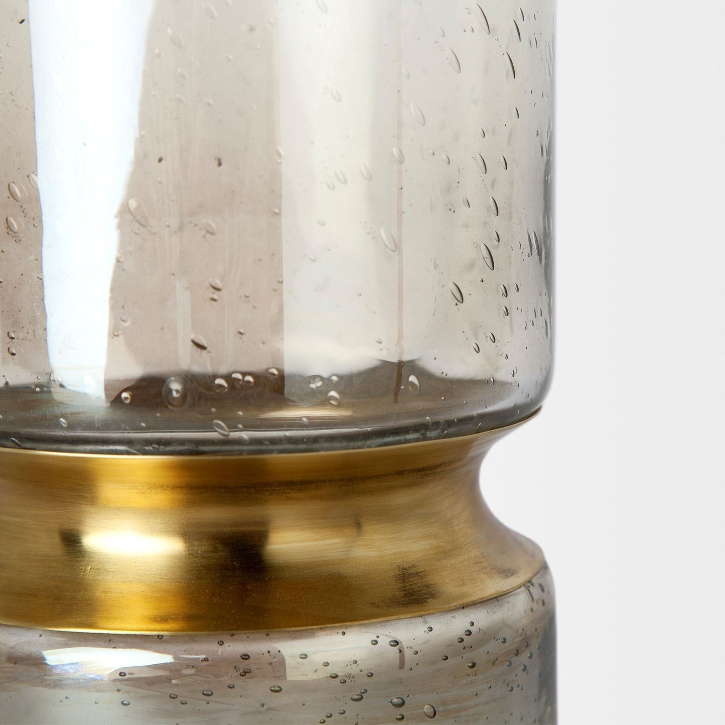 Smoked bubble glass vase detail showing premium craftsmanship and light-reflective gold finish