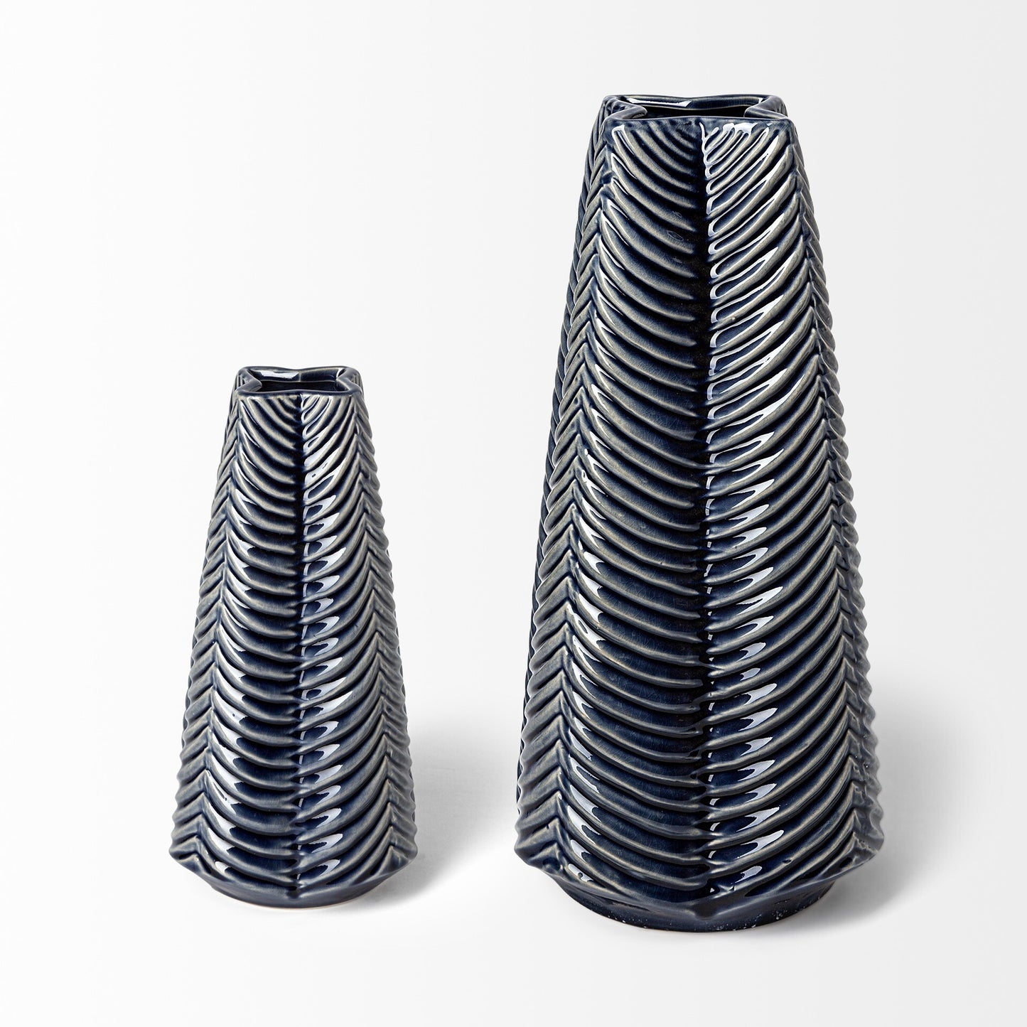 Side angle of 16-inch Prussian blue star vase displaying dimensional four-pointed design with architectural depth and sophisticated glazed finish