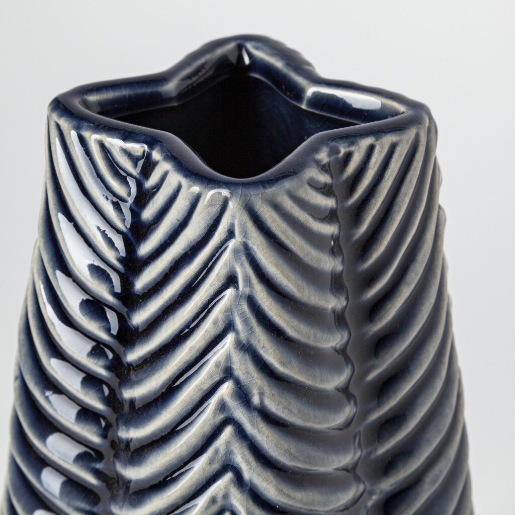 Three-quarter view of large star-shaped vase emphasizing unique geometric design, layered blue glaze, and sculptural quality perfect for contemporary interiors