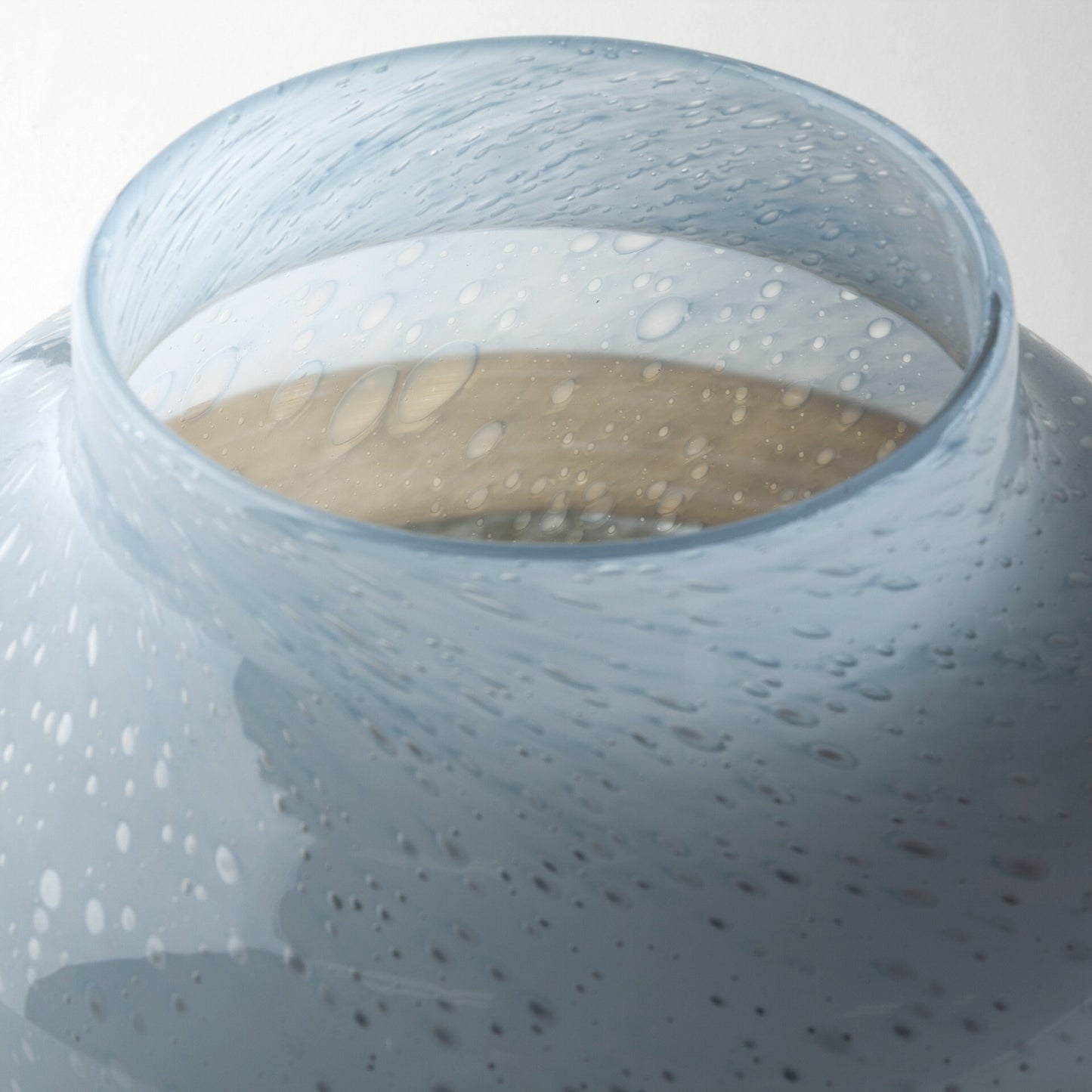 Coastal bubble glass vase alternative angle showing one-of-a-kind blue brown ocean pattern