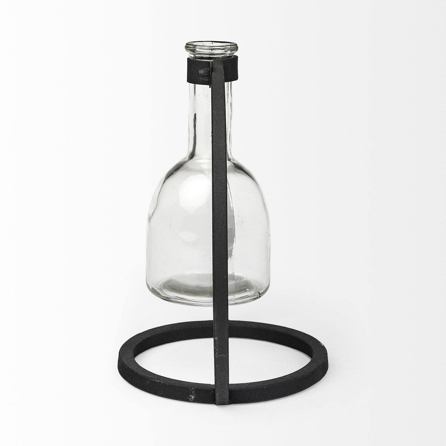 Abstract glass and metal vase side view showing clear cylinder with black accents, modern home decor